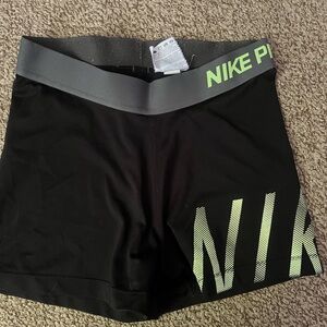Nike Women's Black and Green Athletic Shorts